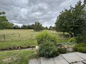 VIEW ACROSS STREAM TO FARMLAND- click for photo gallery